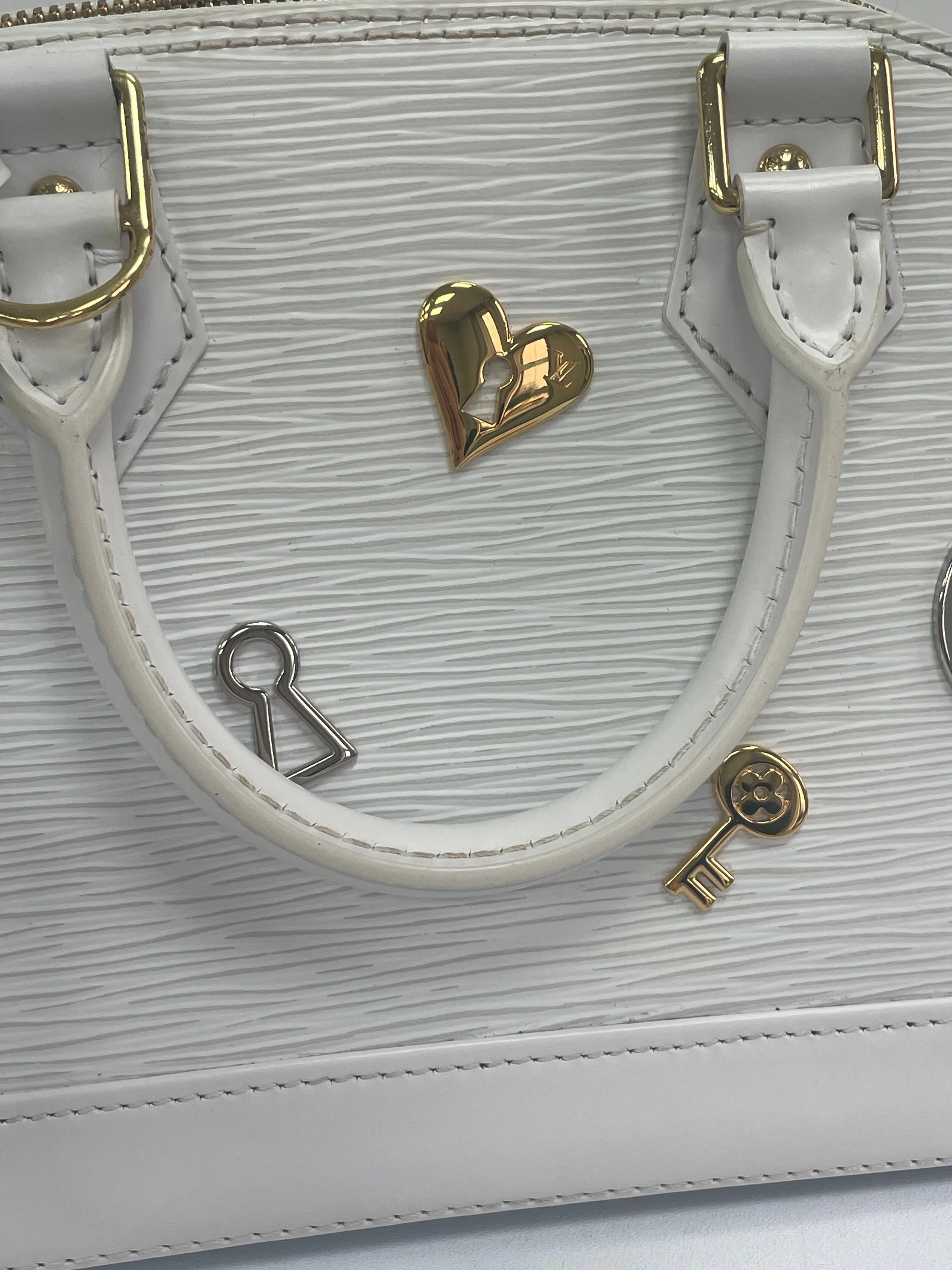 Louis Vuitton White Alma Handbag Love Lock Epi Leather Bb Bag