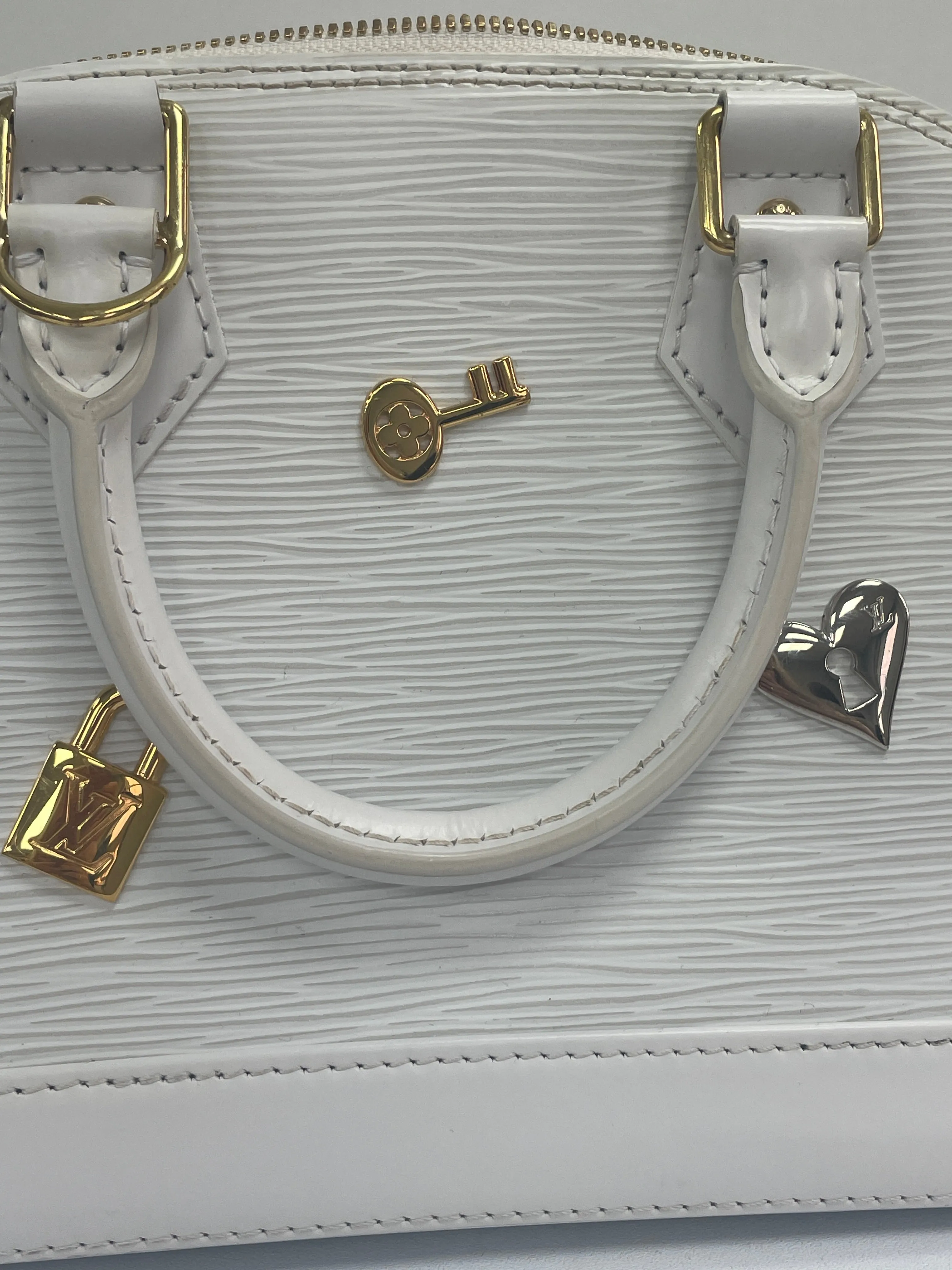 Louis Vuitton White Alma Handbag Love Lock Epi Leather Bb Bag